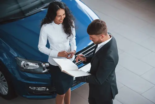 girl-is-smiling-female-customer-modern-stylish-bearded-businessman-automobile-saloon.webp